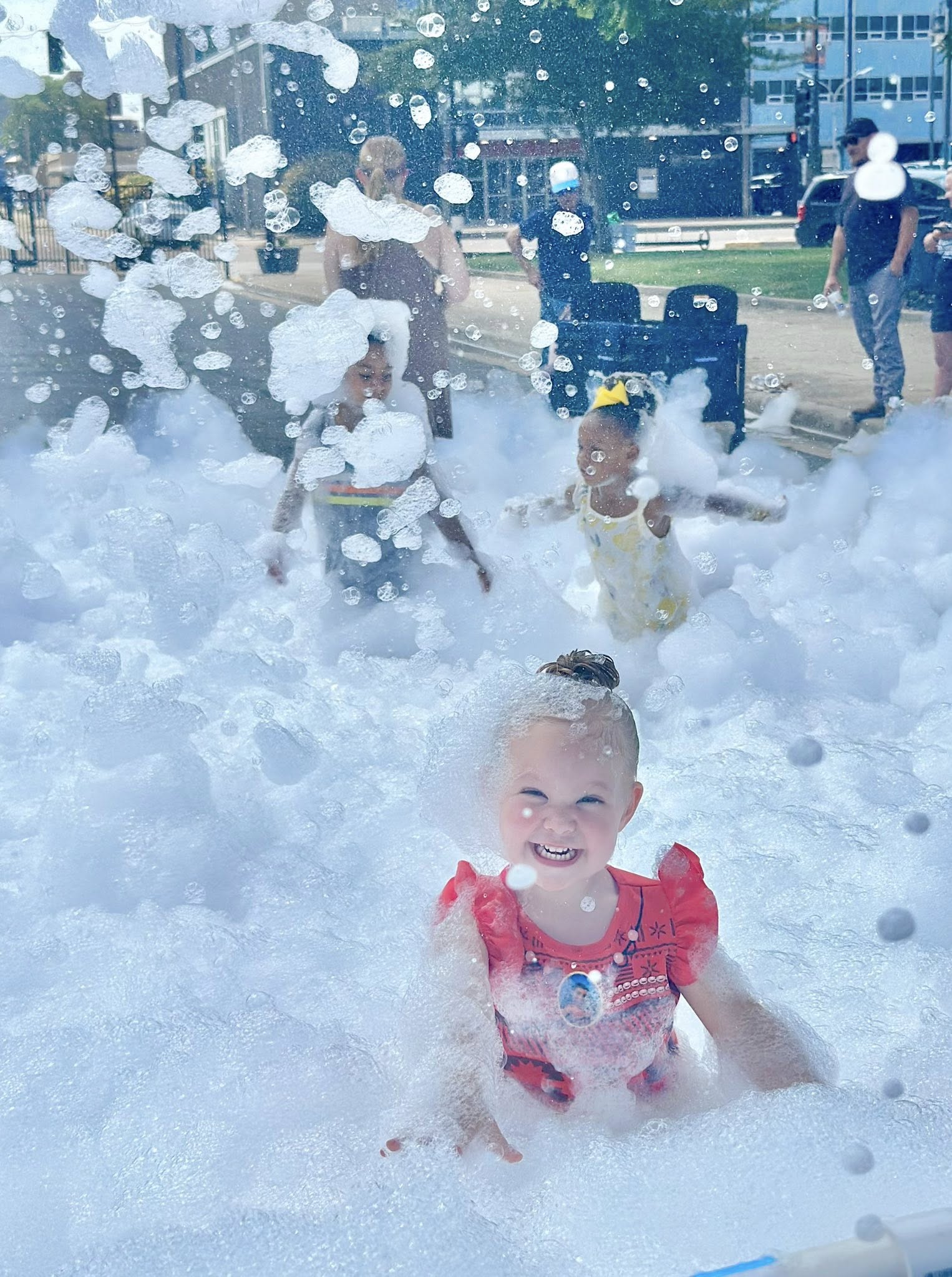 little girl in bubbles